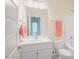 Bright bathroom featuring white vanity, toilet, tub, and a large mirror above the sink at 41 Highveld Ave, Chapel Hill, NC 27516
