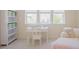 Bright room with white shelves, desk, chaise lounge near windows with view of the neighborhood at 41 Highveld Ave, Chapel Hill, NC 27516