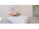 Bright bedroom featuring a white bed with pink accents and a view into the hall at 41 Highveld Ave, Chapel Hill, NC 27516
