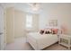 Bright bedroom with plush carpeting features a white-painted bed frame and matching furniture set at 41 Highveld Ave, Chapel Hill, NC 27516
