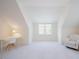 Bright bonus room featuring plush carpet, natural light, and a cozy armchair at 41 Highveld Ave, Chapel Hill, NC 27516