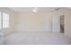 Bonus room features carpet, neutral walls, natural light, and access to the staircase at 41 Highveld Ave, Chapel Hill, NC 27516