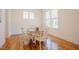 Bright dining room with hardwood floors, neutral walls, and a classic wooden table with chairs at 41 Highveld Ave, Chapel Hill, NC 27516