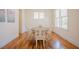 Bright dining room with hardwood floors, neutral walls, and a classic wooden table with chairs at 41 Highveld Ave, Chapel Hill, NC 27516