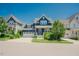 Charming navy blue home featuring a two-car garage and beautifully landscaped front yard at 41 Highveld Ave, Chapel Hill, NC 27516