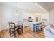 Bright, open kitchen featuring white cabinets, stainless steel appliances, and a center island at 41 Highveld Ave, Chapel Hill, NC 27516