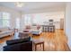 Spacious open-concept living area seamlessly connects to a modern kitchen and dining space with hardwood floors at 41 Highveld Ave, Chapel Hill, NC 27516