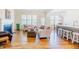 Open concept living room connected to the kitchen featuring hardwood floors, a fireplace, and comfortable seating at 41 Highveld Ave, Chapel Hill, NC 27516