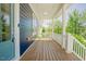 Inviting covered porch with white railings and wood flooring, perfect for relaxing outdoors at 41 Highveld Ave, Chapel Hill, NC 27516