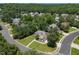 Aerial view of a home in a mature, wooded neighborhood at 413 Great Smokey Mountain Dr, Mebane, NC 27302