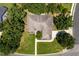 Aerial view of a beautiful home showcasing its mature trees, manicured lawn, and expansive lot in a great neighborhood at 413 Great Smokey Mountain Dr, Mebane, NC 27302