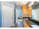 Well-lit bathroom featuring double sinks and an adjoining bedroom view at 413 Great Smokey Mountain Dr, Mebane, NC 27302