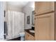 Cozy bathroom with a shower-tub combo and ample cabinet space at 413 Great Smokey Mountain Dr, Mebane, NC 27302