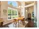 Bright dining area with large windows and stylish furniture at 413 Great Smokey Mountain Dr, Mebane, NC 27302
