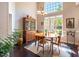 Sunlit dining room with hardwood floors and elegant decor at 413 Great Smokey Mountain Dr, Mebane, NC 27302