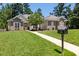 Charming single-Gathering home with a well-manicured front yard, inviting entrance, and traditional architectural details at 413 Great Smokey Mountain Dr, Mebane, NC 27302