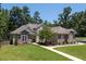 Beautiful home with brick accents and a well-maintained lawn at 413 Great Smokey Mountain Dr, Mebane, NC 27302