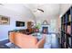 Cozy living room with a fireplace, built-in shelving, and comfortable seating, perfect for relaxation at 413 Great Smokey Mountain Dr, Mebane, NC 27302