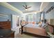 Spacious main bedroom with tray ceilings, ceiling fan, and plenty of natural light at 413 Great Smokey Mountain Dr, Mebane, NC 27302