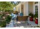Inviting patio area with colorful rug, comfortable seating, and lush greenery creating a cozy outdoor space at 413 Great Smokey Mountain Dr, Mebane, NC 27302