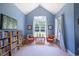 Cozy sitting area with a vaulted ceiling and ample natural light provides a bright and inviting space at 413 Great Smokey Mountain Dr, Mebane, NC 27302
