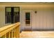 Exterior porch featuring railing and access to the private backyard at 4217 Us-70, Durham, NC 27705