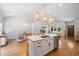 Bright kitchen with a center island and bar seating, open to the living and dining areas at 4217 Us-70, Durham, NC 27705