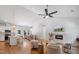 Open-concept living area boasts hardwood floors, modern fireplace, and seamless flow to kitchen and dining space at 4217 Us-70, Durham, NC 27705