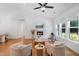 Bright living room featuring hardwood floors, a cozy fireplace, and large windows for natural light at 4217 Us-70, Durham, NC 27705
