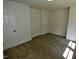 A spacious bedroom has neutral carpet, white trim, and a closet at 4414 Nc Hwy 87 N, Pittsboro, NC 27312