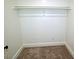 Walk-in closet features carpet and a rod for hanging clothes at 4414 Nc Hwy 87 N, Pittsboro, NC 27312