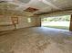 Spacious garage featuring an open layout and natural light, providing ample room for parking and storage at 4414 Nc Hwy 87 N, Pittsboro, NC 27312