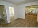Hallway view showing entrances to bedrooms and a living area, with consistent flooring at 4414 Nc Hwy 87 N, Pittsboro, NC 27312