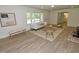 Cozy living room with wood floors, comfortable seating, and natural light at 4414 Nc Hwy 87 N, Pittsboro, NC 27312