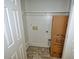 A utility closet with hookups for a washer and dryer. Large box in the corner at 4414 Nc Hwy 87 N, Pittsboro, NC 27312