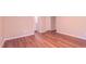 The primary bedroom features luxury vinyl plank flooring and a bright, neutral color scheme at 4928 Silverdene St, Raleigh, NC 27616