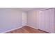 Bedroom featuring closets, wood-look flooring, and a window for natural light at 4928 Silverdene St, Raleigh, NC 27616