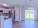 Stylish kitchen featuring stainless steel appliances, white cabinets, and sliding glass doors at 4928 Silverdene St, Raleigh, NC 27616