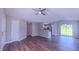 Open-concept living area with wood floors, neutral walls, and sliding glass doors to the outside at 4928 Silverdene St, Raleigh, NC 27616
