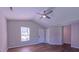 Open living area with vaulted ceilings, ceiling fan, and wood-look floors for a modern feel at 4928 Silverdene St, Raleigh, NC 27616