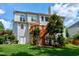 Expansive backyard featuring a wooden deck, mature trees, and a lush lawn at 500 Walcott Way, Cary, NC 27519
