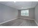 Finished basement with a neutral color palette and a window for natural light at 500 Walcott Way, Cary, NC 27519