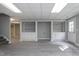 Large basement area with neutral walls and floors and built in storage cabinets at 500 Walcott Way, Cary, NC 27519