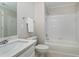 Clean bathroom with shower and tub, modern lighting, and white fixtures at 500 Walcott Way, Cary, NC 27519