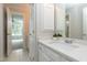 Bathroom with a white countertop, vanity and cabinets and access to an adjoined bedroom at 500 Walcott Way, Cary, NC 27519