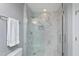 Lovely bathroom featuring an updated shower with marble tile surround, pebble floor, and glass door at 500 Walcott Way, Cary, NC 27519