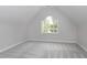 Well-lit bedroom with a large window, neutral carpet, and white walls at 500 Walcott Way, Cary, NC 27519