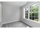 Simple bedroom with plush carpet and a window offering a view of the outdoors at 500 Walcott Way, Cary, NC 27519