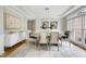Elegant dining room featuring stylish chandelier, large windows, and sophisticated decor at 500 Walcott Way, Cary, NC 27519