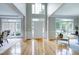 Grand foyer with soaring ceilings, gleaming hardwood floors, and abundant natural light at 500 Walcott Way, Cary, NC 27519